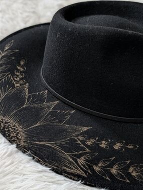 Wild Child Black Wide-Brim Hat with Gold Colored Sunflower Engraving